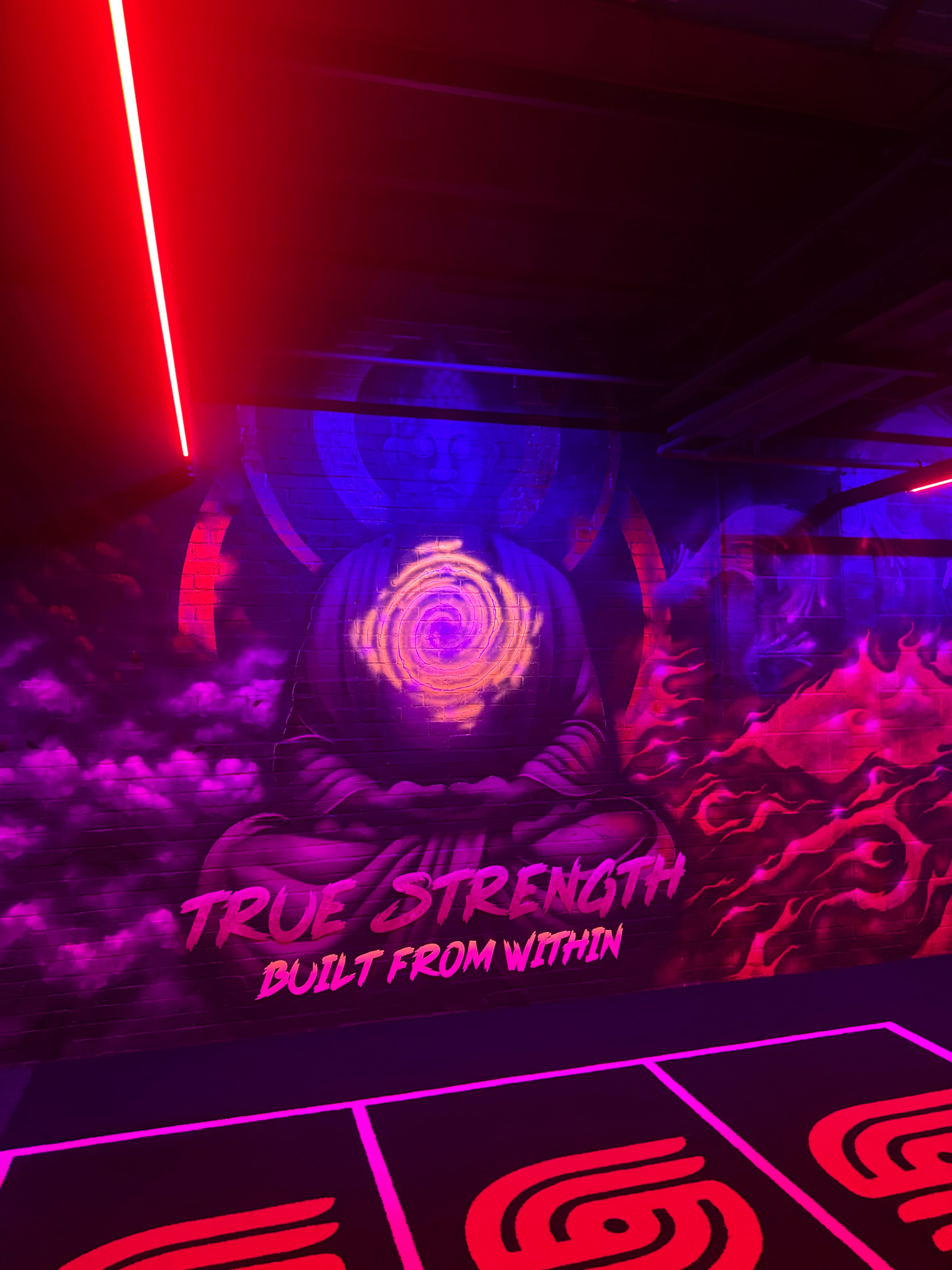 True Strength — Built From Within mural at Just Train gym